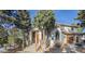 Charming two-story home with stone accents, mature trees, and inviting front entrance at 17870 New London Rd, Monument, CO 80132