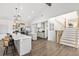 Modern kitchen features an island with bar seating and stainless steel appliances at 17870 New London Rd, Monument, CO 80132