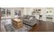 Inviting living room featuring a comfortable sofa, wood floors, and access to the outdoor area at 17870 New London Rd, Monument, CO 80132
