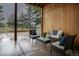Covered patio furnished with wicker seating, offering a relaxing outdoor space at 17870 New London Rd, Monument, CO 80132