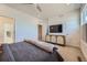 Bright bedroom with a television, neutral walls and carpet, offering a relaxing retreat at 2052 Alcott Way, Broomfield, CO 80023
