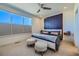 Bright bedroom features a modern headboard and ceiling fan at 2052 Alcott Way, Broomfield, CO 80023