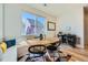 Bright dining area features built-in bench seating and stylish bar with beverage storage at 2052 Alcott Way, Broomfield, CO 80023