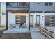 Inviting front porch with stylish seating and a cozy ambiance for relaxing outdoors at 2052 Alcott Way, Broomfield, CO 80023
