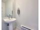 Clean, bright half-bathroom with modern fixtures and a stylish pedestal sink at 2052 Alcott Way, Broomfield, CO 80023