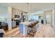 Spacious kitchen boasts a large island with seating, stylish cabinets, and modern appliances at 2052 Alcott Way, Broomfield, CO 80023