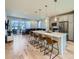 Modern kitchen with large island, pendant lighting, and stainless steel appliances at 2052 Alcott Way, Broomfield, CO 80023