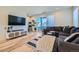 Cozy living room with a large sectional sofa and access to outdoor balcony at 2052 Alcott Way, Broomfield, CO 80023