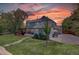 Large backyard with a covered patio area, a barbeque grill and ample green space perfect for entertaining and recreation at 20113 Edinborough Ct, Parker, CO 80138