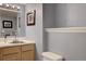 Cozy bathroom features a light wood vanity and a white toilet at 20113 Edinborough Ct, Parker, CO 80138