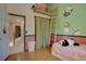 bedroom with wood floors, lofted reading nook, and bamboo decal at 20113 Edinborough Ct, Parker, CO 80138