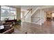 Warm and inviting foyer features hardwood floors, lots of natural light and stairway at 20113 Edinborough Ct, Parker, CO 80138
