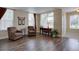 Comfortable living room featuring hardwood floors, lots of natural light, and an open floor plan at 20113 Edinborough Ct, Parker, CO 80138