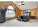 Spacious main bedroom with vaulted ceilings, large window, comfortable king bed, and accent chair at 20113 Edinborough Ct, Parker, CO 80138