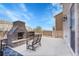 Patio includes an outdoor fireplace and ample space for entertaining guests at 1628 Taos St, Brighton, CO 80603