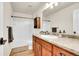 Bathroom features a wooden vanity, large mirror, and a shower with a tub at 1628 Taos St, Brighton, CO 80603