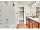 Bright bathroom with double sink vanity, walk-in shower, and elegant finishes at 1628 Taos St, Brighton, CO 80603