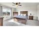 Comfortable bedroom features a large bed, dresser and natural light streaming through the window at 1628 Taos St, Brighton, CO 80603