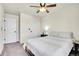 Bright bedroom boasts a ceiling fan, closet and ample natural light at 1628 Taos St, Brighton, CO 80603