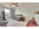Upstairs bonus room with carpet flooring, a window, and a closet with wooden shelves at 1628 Taos St, Brighton, CO 80603