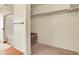 Walk-in closet with ample shelving, carpeted floors, and an adjacent bathroom at 1628 Taos St, Brighton, CO 80603