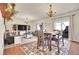 Bright and open living space with elegant chandeliers, hardwood floors, and comfortable seating at 1628 Taos St, Brighton, CO 80603