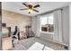 Well-lit office space with wood accent wall and a large window for natural light at 1628 Taos St, Brighton, CO 80603