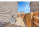 Utility side yard with gravel, AC unit, and access gate between the houses, offering functionality and privacy at 1628 Taos St, Brighton, CO 80603