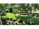Expansive backyard view showcasing lush greenery, mature trees, and well-manicured landscaping at 164 W Acoma Dr, Littleton, CO 80120