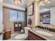 Bathroom features granite counters, a linen closet, and a separate toilet room at 164 W Acoma Dr, Littleton, CO 80120
