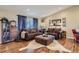 Inviting living room with hardwood floors, plush sofas, and stylish decor at 164 W Acoma Dr, Littleton, CO 80120