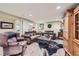 Spacious living room with wood floors, comfortable seating, and rustic decor at 164 W Acoma Dr, Littleton, CO 80120