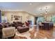 Spacious living room with hardwood floors, recessed lighting, and an open layout at 164 W Acoma Dr, Littleton, CO 80120