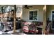 Entertainer's patio featuring outdoor kitchen, stainless steel grill, sink, and comfortable dining area at 164 W Acoma Dr, Littleton, CO 80120