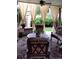 Cozy screened-in porch with comfortable seating and views of the landscaped backyard at 164 W Acoma Dr, Littleton, CO 80120