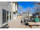 Wooden deck featuring outdoor seating, with sliding glass doors providing access to the home at 1642 S Trenton St, Denver, CO 80231