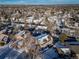 Aerial view of a residential neighborhood showcasing snow-covered homes and landscaping at 7700 W Glasgow Pl # 19C, Littleton, CO 80128