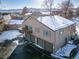 Back exterior view of the property, showing the garage and balcony at 7700 W Glasgow Pl # 19C, Littleton, CO 80128