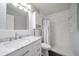 Clean bathroom with marble vanity and shower/tub combo at 7700 W Glasgow Pl # 19C, Littleton, CO 80128