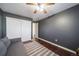 Charming bedroom with gray walls and wood floors at 7700 W Glasgow Pl # 19C, Littleton, CO 80128