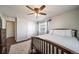 Comfortable bedroom with wood floors and a ceiling fan at 7700 W Glasgow Pl # 19C, Littleton, CO 80128