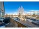 View from deck shows parking and mature trees at 7700 W Glasgow Pl # 19C, Littleton, CO 80128