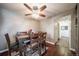 Bright dining area with wood floors and a ceiling fan at 7700 W Glasgow Pl # 19C, Littleton, CO 80128