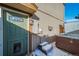 Exterior view of the home's entrance and hot tub area at 7700 W Glasgow Pl # 19C, Littleton, CO 80128