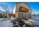 Exterior of the property showing the garage, balcony and landscaping at 7700 W Glasgow Pl # 19C, Littleton, CO 80128