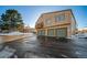 Exterior view of the property, showcasing the garage and balcony at 7700 W Glasgow Pl # 19C, Littleton, CO 80128