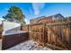 Relaxing hot tub in a fenced backyard with wooden fencing and gate at 7700 W Glasgow Pl # 19C, Littleton, CO 80128