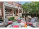 Landscaped backyard with patio seating, stylish accents and mature trees at 1007 N Ogden St, Denver, CO 80218