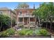 Charming home with a multi-level deck, lush garden, and landscaped backyard at 1007 N Ogden St, Denver, CO 80218