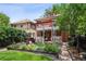 Charming home with a multi-level deck, lush garden, and landscaped backyard at 1007 N Ogden St, Denver, CO 80218